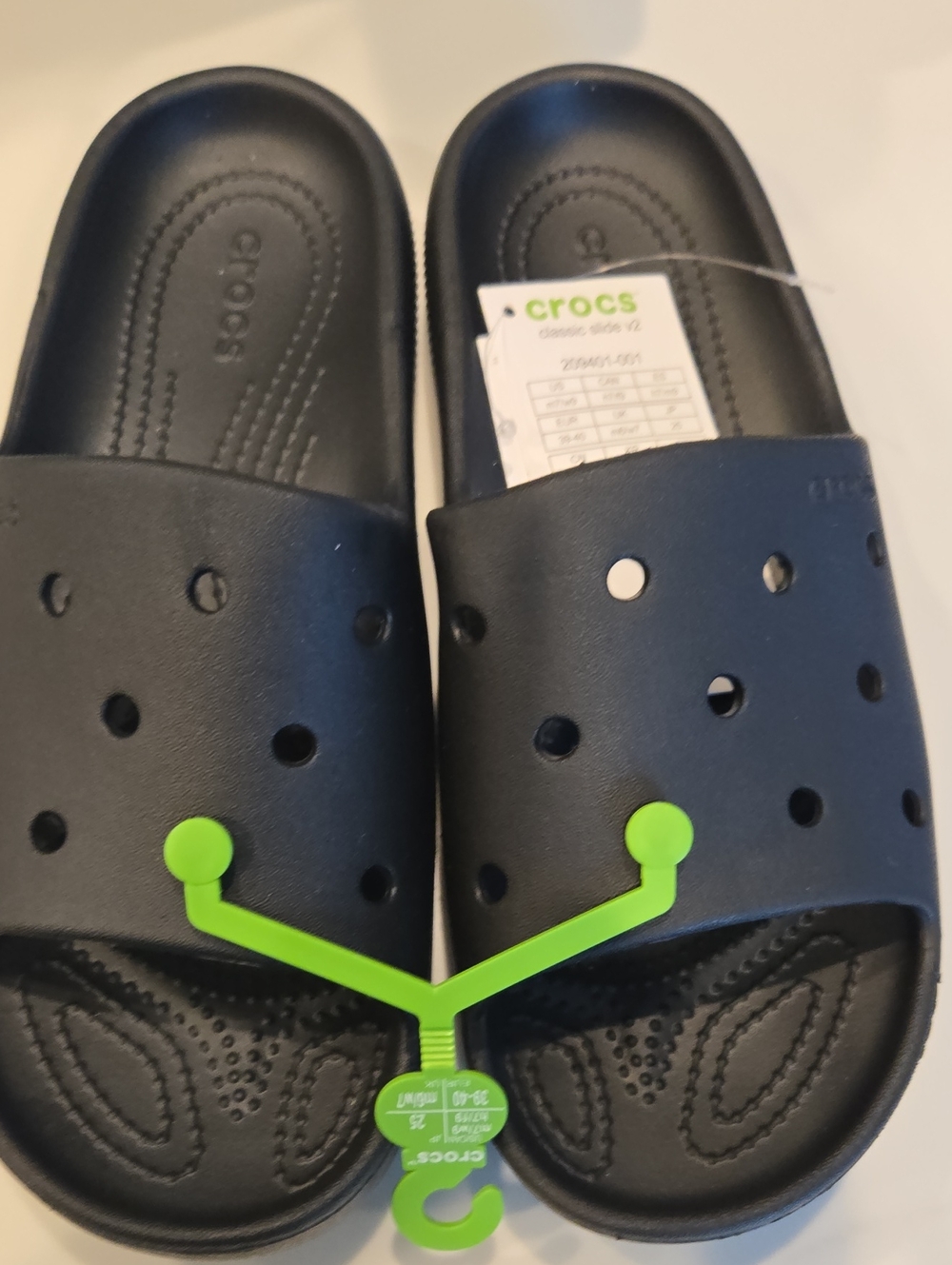 CROCS Black Slide Sandals with holes to add your favorite gidgets.